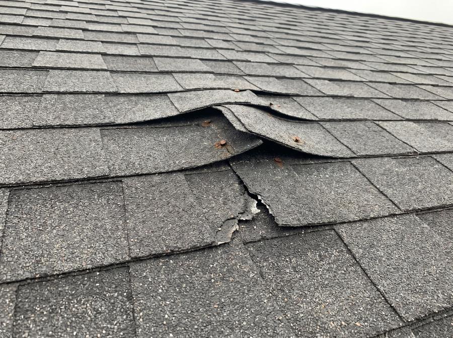Sample photo: displaced roof shingle tabs